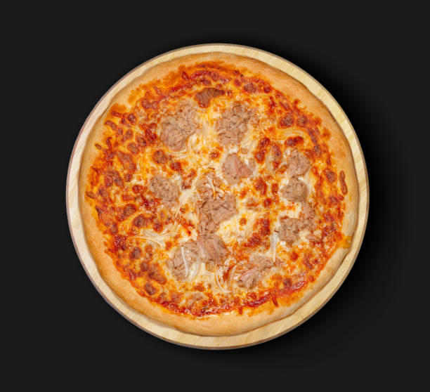istock Isolated Tuna Pizza on a black background. 1125491389
