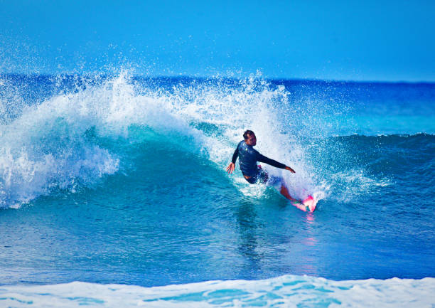 istock Surfer Surfing in Poipu Beach, Kauai,Hawaii 1125502182