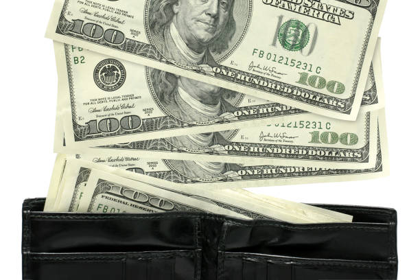 Loaded wallet full of cash in large amounts.