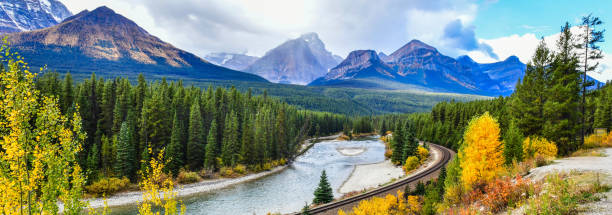 Morant's Curve railway in Canadian rockies, Canada Panorama view Morant's Curve railway in Canadian rockies in autumn ,Banff National Park, Canada canadian rockies stock pictures, royalty-free photos & images