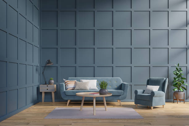 istock Blue sofa and armchair against dark blue wall 1125525155
