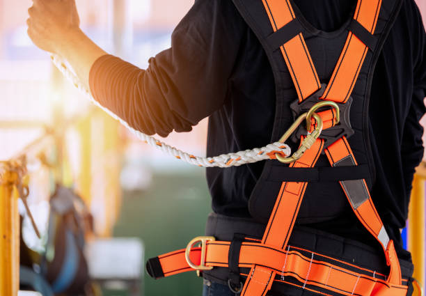 construction worker wearing safety harness. - high up imagens e fotografias de stock