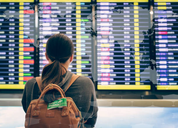 istock Young woman with backpack in airport. 1125526959