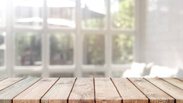 istock Empty wood table top and blurred bokeh cafe and restaurent interior background with vintage filter - can used for display or montage your products. 1125527902