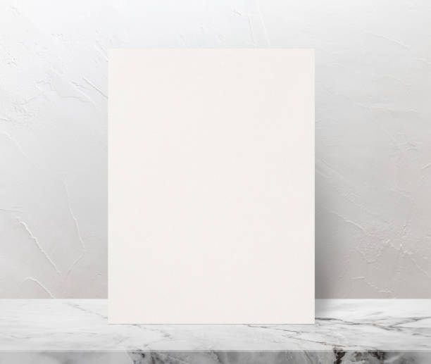 istock Blank Eco textured paper poster on marble stone table top at white wall background,Template mock up for adding your design. 1125527906