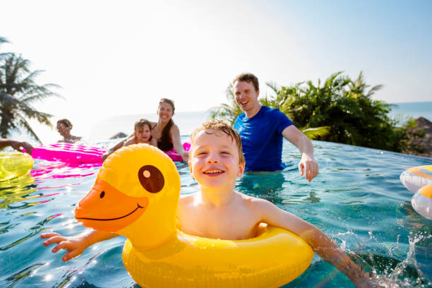 istock Family playing in a pool 1125533725