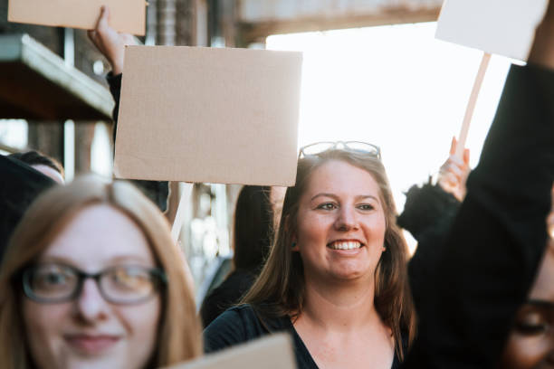 istock Happy activists marching through the city 1125535102