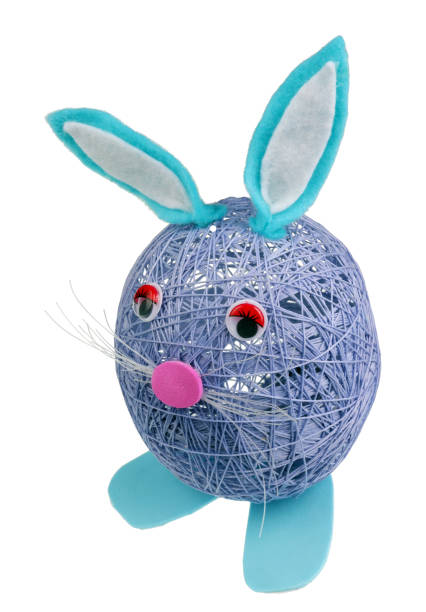 istock A  handmade sad lonely  Easter bunny boy made of blue cotton  threads. Isolated 1125543712