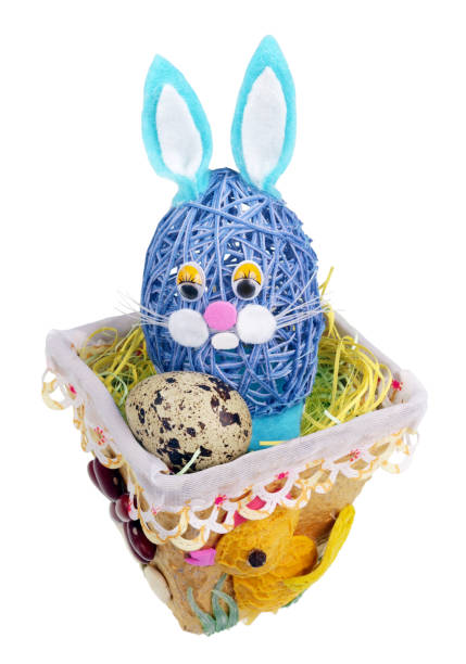 istock Easter handmade  nest from rope with funny bunny  and  quail egg. Isolated 1125543759