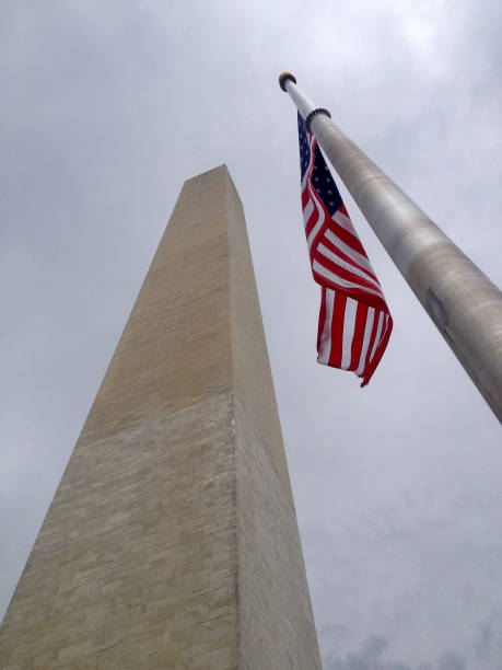 istock Washington National Monument and American Flag 1125546241