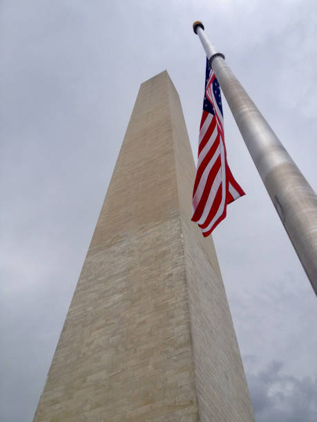 istock Washington National Monument and American Flag 1125546242
