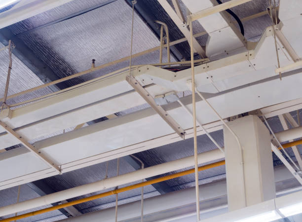 istock Ceiling mounted Lamps pipes and air ducts and communication system 1125549347