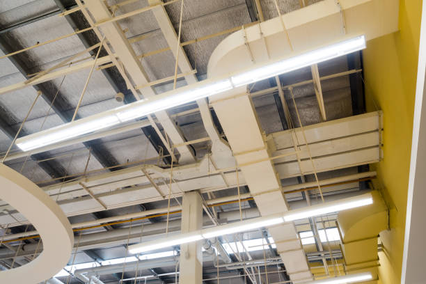 istock Ceiling mounted Lamps pipes and air ducts and communication system 1125549348