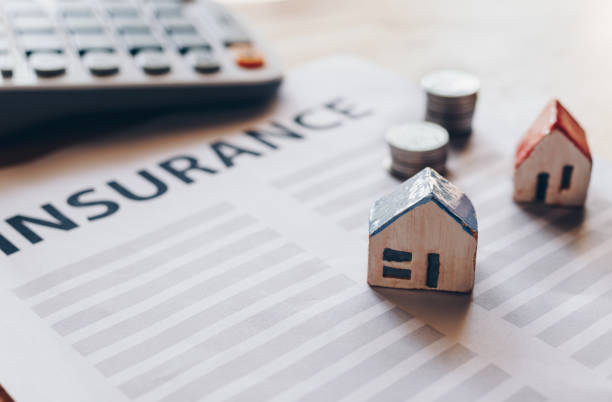 istock Home insurance form with money,passbook  and calculator. 1125549736