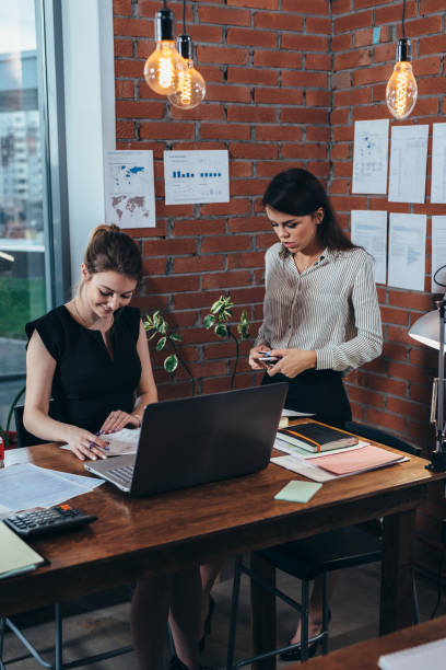 istock Two female colleagues in office working together. 1125551114