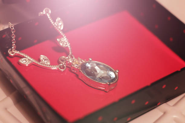 istock Diamond chain with a green pendant in gift box 1125552596
