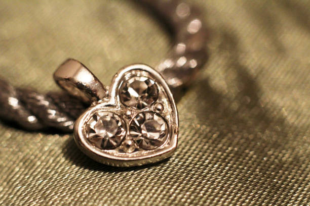 istock Silver heart pendant very close, Valentine's day 1125553470