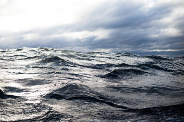 istock Winter sailing. Cold blue sea at sunset. waves and clouds, Norway 1125565080