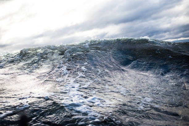 istock Winter sailing. Cold blue sea at sunset. waves and clouds, Norway 1125565082