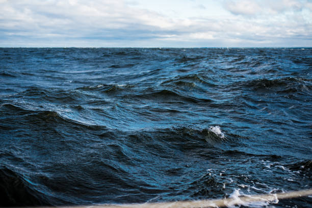istock Winter sailing. Cold blue sea at sunset. waves and clouds, Norway 1125565085