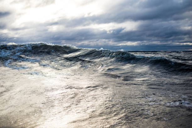 istock Winter sailing. Cold blue sea at sunset. waves and clouds, Norway 1125565087
