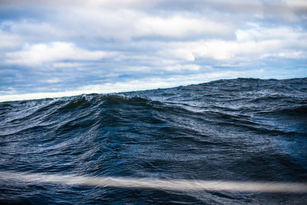 istock Winter sailing. Cold blue sea at sunset. waves and clouds, Norway 1125565088