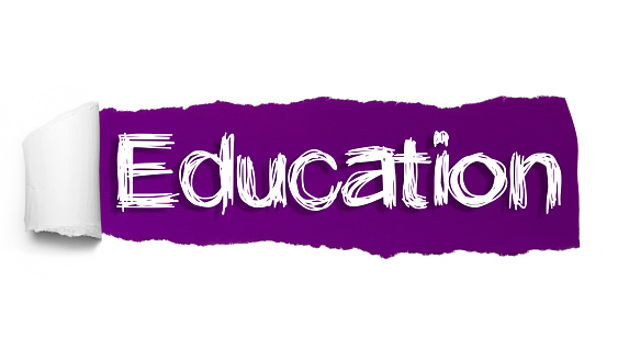 EDUCATION text, Inspiration, Motivation and Business concept on Purple torn paper.