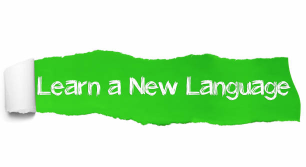istock Learn a New Language text, Inspiration, Motivation and Business concept on Green torn paper 1125567360