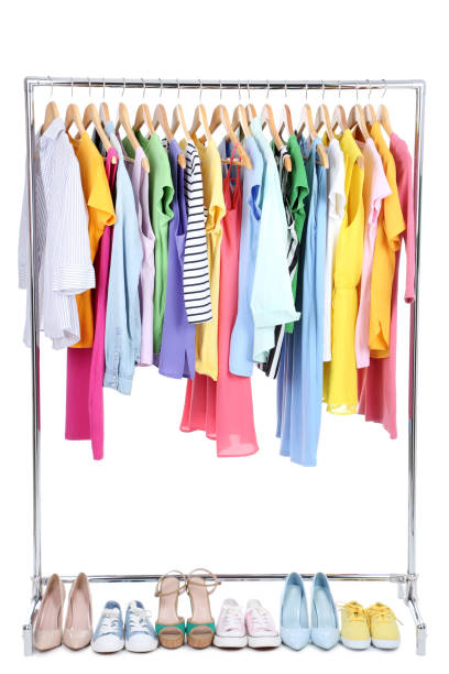 istock Clothes hanging on wooden hanger and different shoes 1125570448