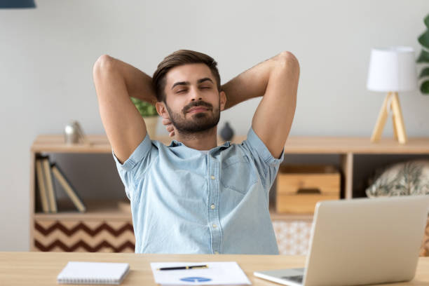 istock Satisfied man taking break to relax finished work at home 1125572496