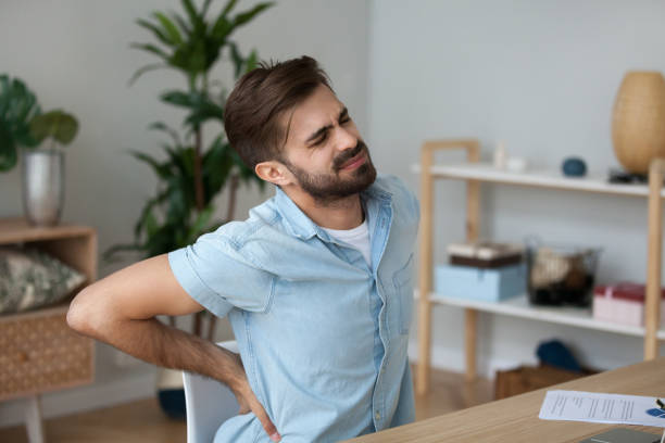 istock Tired man feeling pain in back suffering from lower backache 1125572534