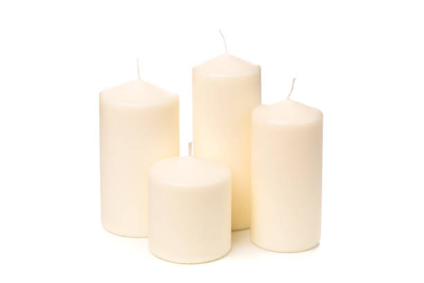 istock White candle on white background isolated. Set of wax candle. 1125573238