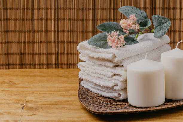 istock Spa still life with aromatic candles, flower and towel. - Image 1125574164