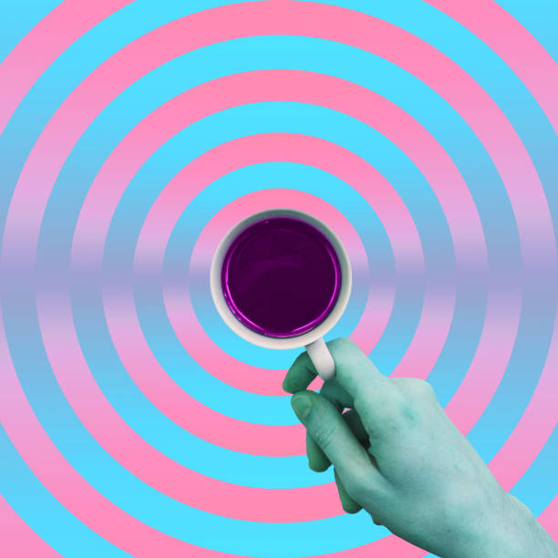 istock alien green hand holding cup of hot drink 1125575732
