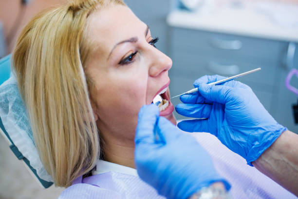 istock Woman having teeth examined at dentists 1125578029