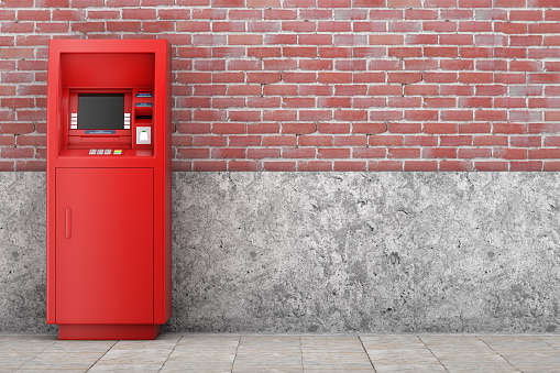 Red Bank Cash ATM Machine in front of brick wall. 3d Rendering