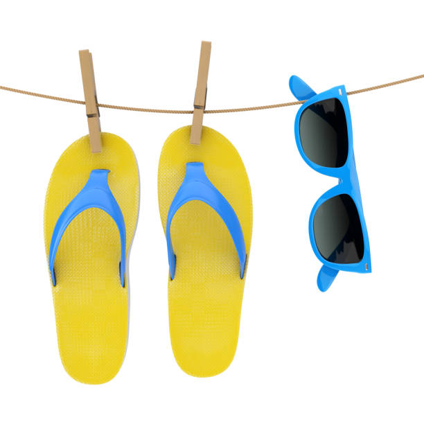 istock Colorful Modern Flip Flops with Blue Sunglasses Hanging on Clothesline. 3d Rendering 1125580647