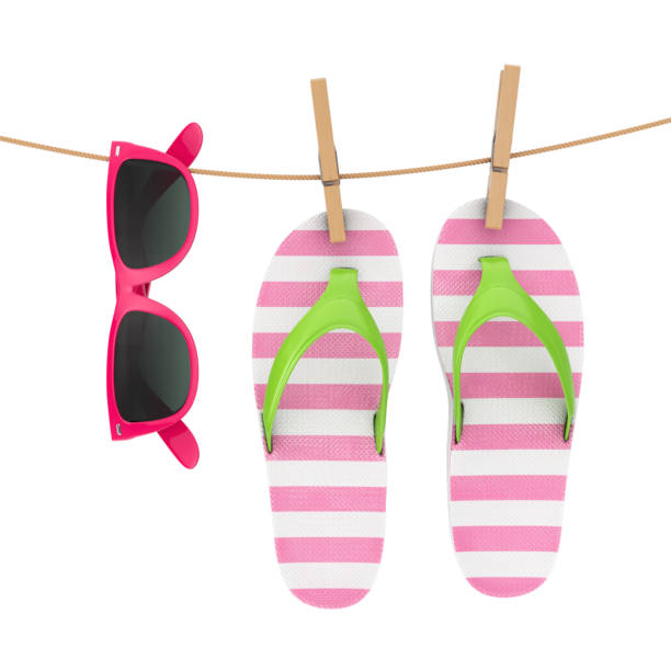 istock Colorful Modern Flip Flops with Pink Sunglasses Hanging on Clothesline. 3d Rendering 1125580702