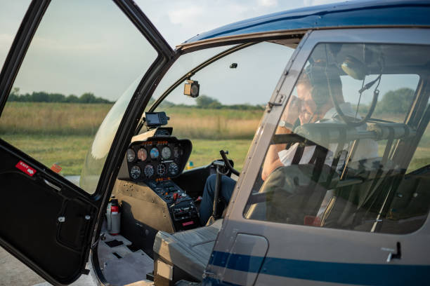 istock Helicopter pilot putting sunglasses on in cockpit 1125581353