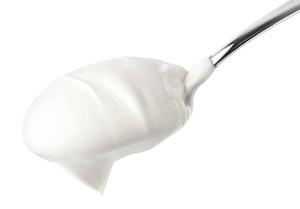 istock sour cream in glass, mayonnaise, yogurt, isolated on white background, clipping path, full depth of field 1125584435