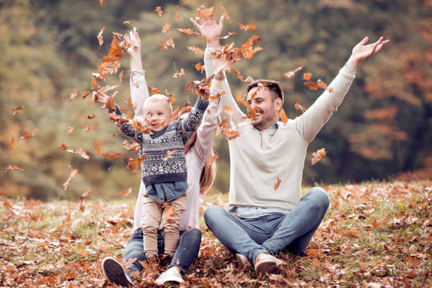 istock Young couple in love having fun with their son in park 1125584809