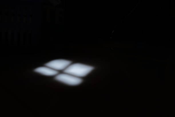 istock Blurred of window's shadow in darkness 1125587129