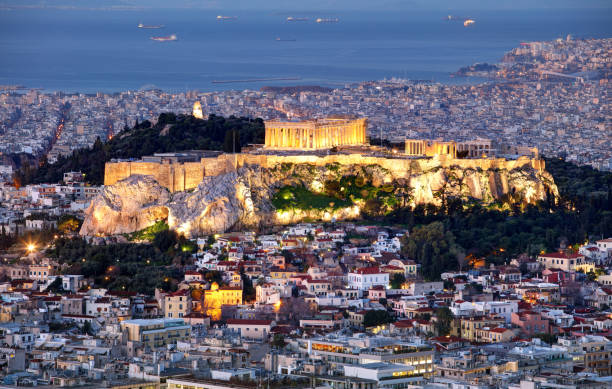 Athens skyline panorama with Acropolis in Greece from peak Lycabettus at night