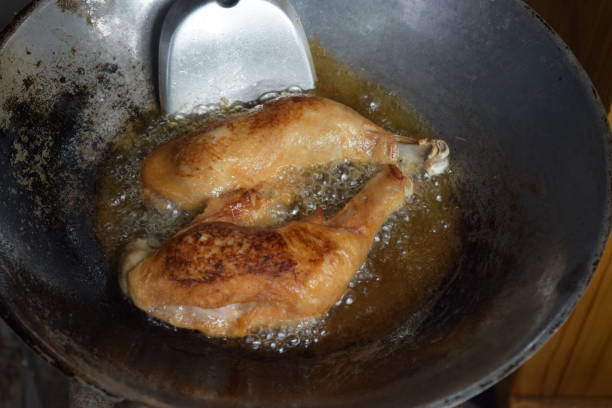 istock Fried chicken calves in an iron pan. 1125588702
