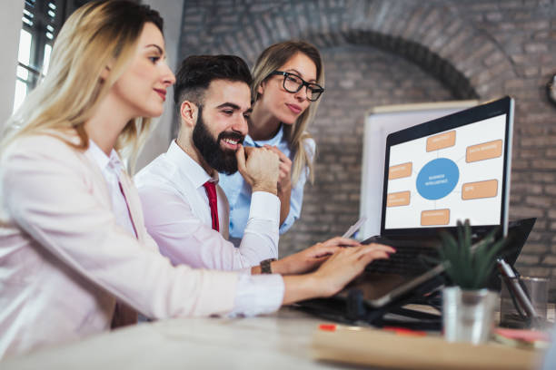 istock Business people working in office together. Team work in office. 1125588927