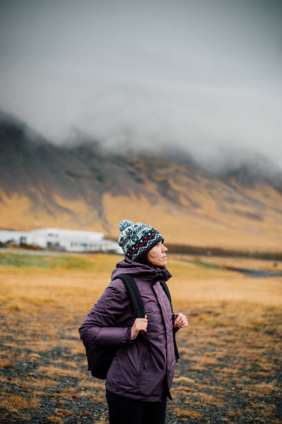 アイスランドの若い女性ハイキング - footpath single lane road sunrise landscape ストックフォトと画像