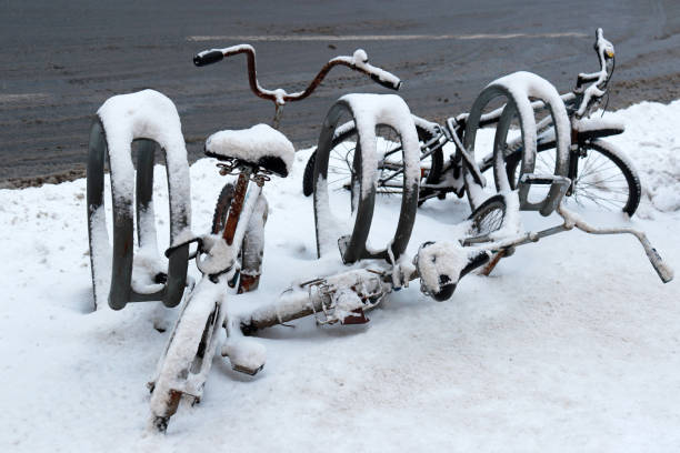 istock Snow covered old bikes in the parking lot 1125589644