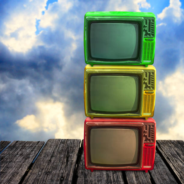 istock Retro television overlap on wooden deck with clouds sky background 1125590720