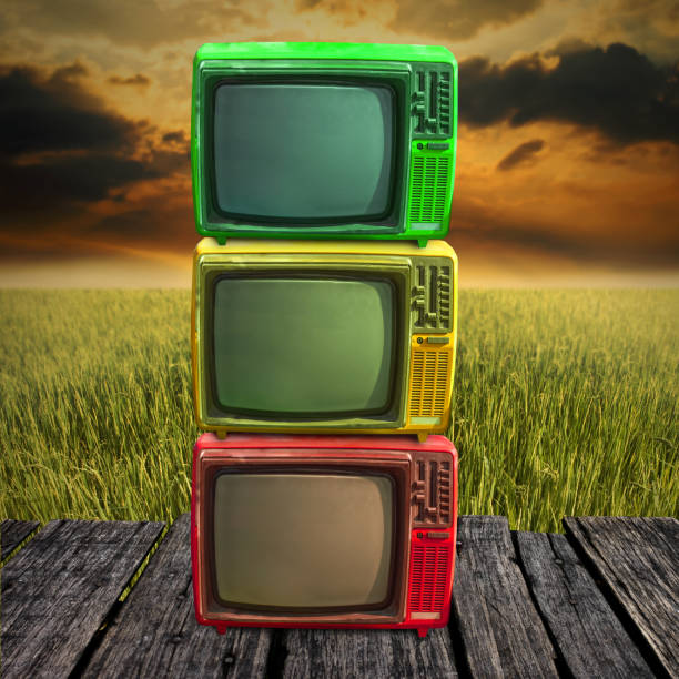 istock Retro television overlap on wooden deck with farmland background 1125590728