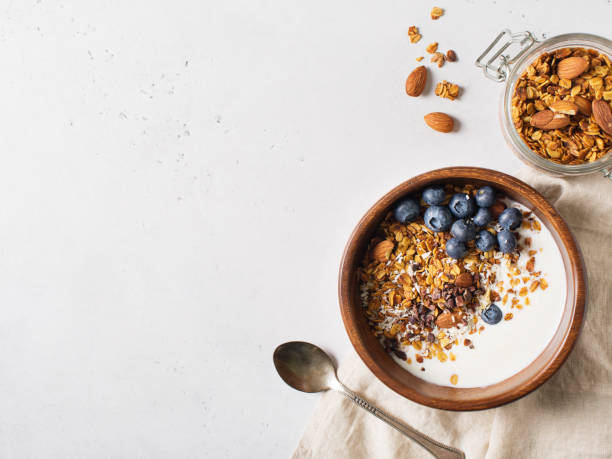 istock Homemade granola muesli with blueberries on white background breakfast 1125590863